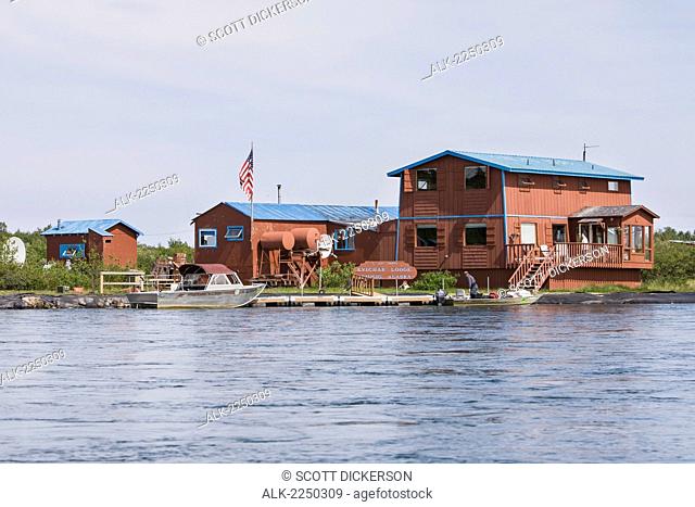 A View Of The Kvichak Lodge From The Water With Riverboats Docked On The Kvichak River; Bristol Bay Igiugig Alaska United States Of America