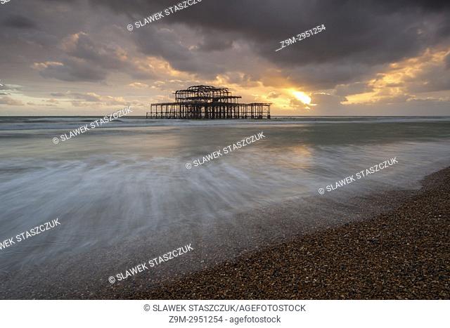 Sunset at West Pier ruins in Brighton, East Sussex, England