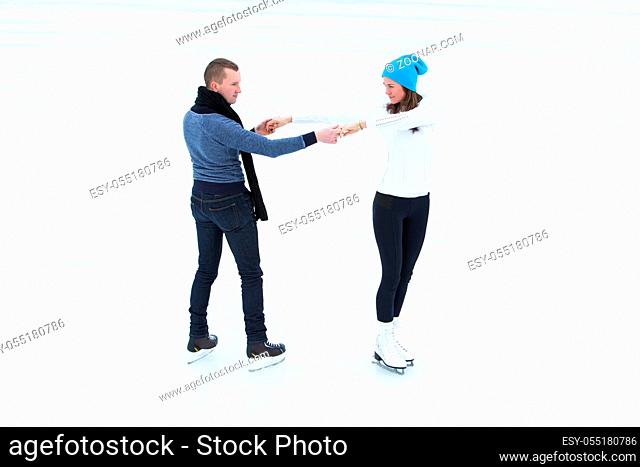 Beautiful, attractive couple on the ice rink