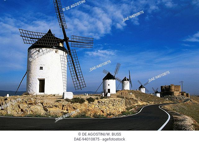 Windmills along the road of Don Quixote, at Consuegra, with La Muela Castle in the background, Castilla-La Mancha, Spain