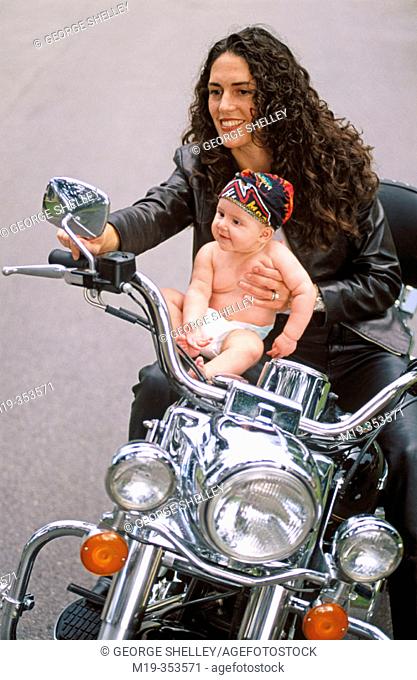 Mother and baby on motorbike