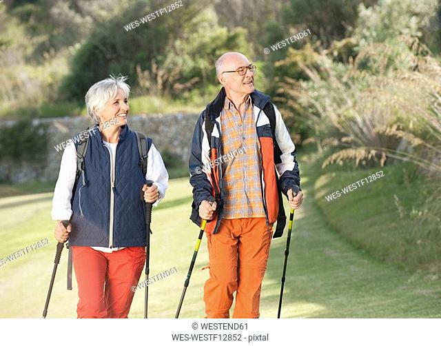 Spain, Mallorca, Senior couple Nordic Walking