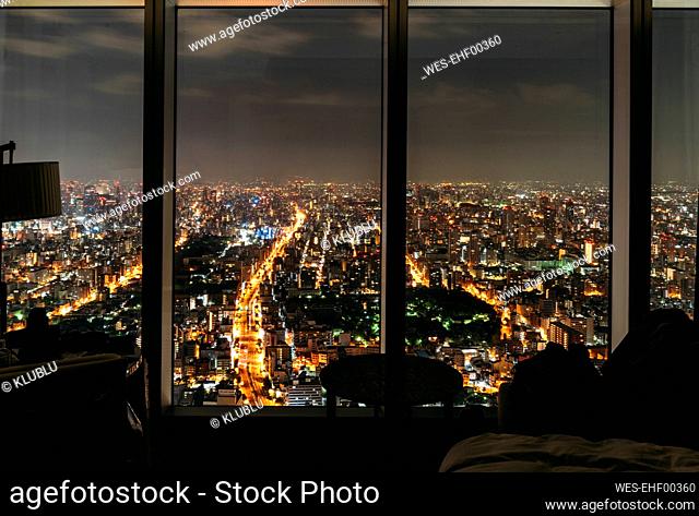 Japan, Osaka Prefecture, Osaka, City at night seen from hotel room