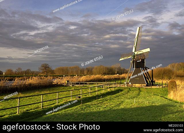 The Follega windmill near the Dutch village Laag-Keppel seen under a clouded sky just before the start of a heavy shower