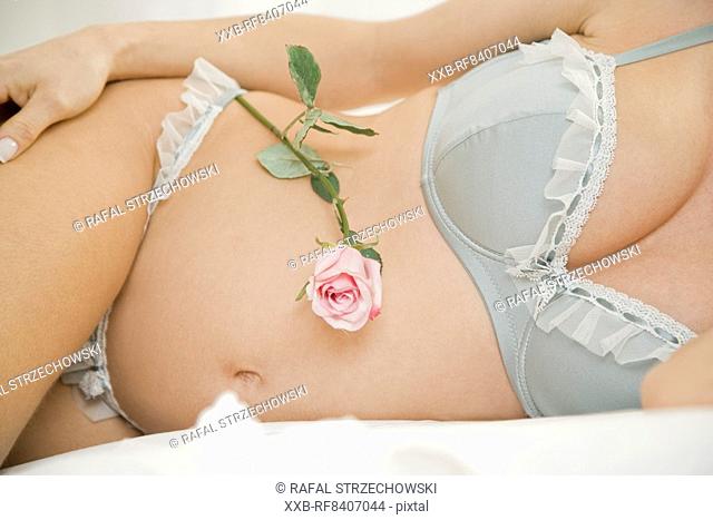 pregnant woman with rose