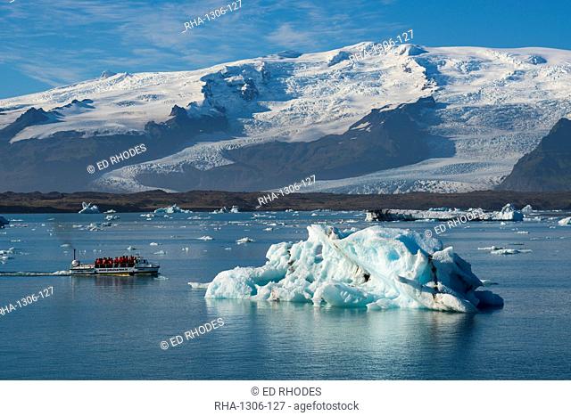 A boat tour on Jokulsarlon Glacier Lagoon, with Breidamerkurjokull Glacier behind, South East Iceland, Iceland, Polar Regions