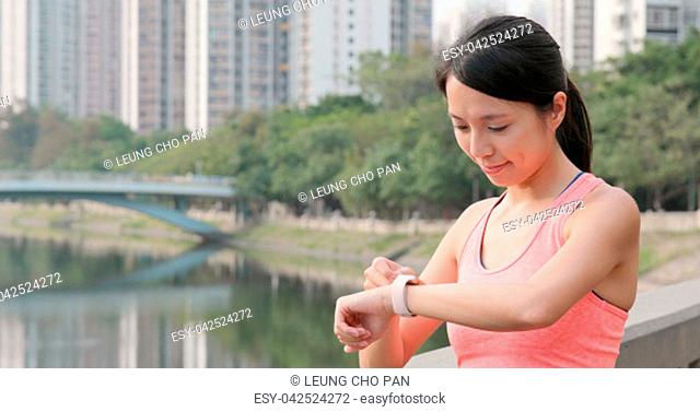 Sport woman checking the data on smart watch