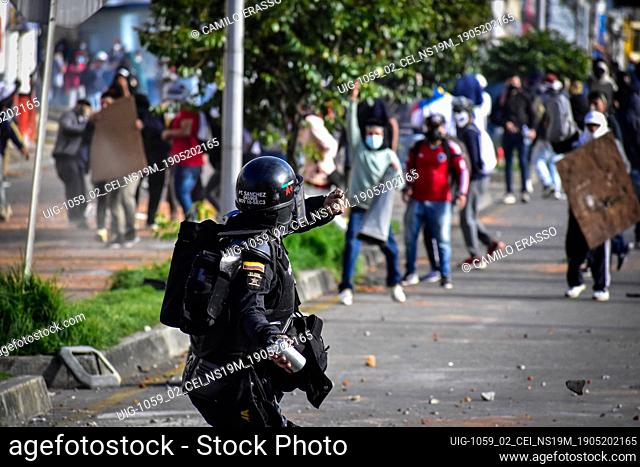 Riot police try to disband demostrators with tear gas and stunt granades in Pasto, Narino on May 19, 2021 during an antigovernment protest against police...