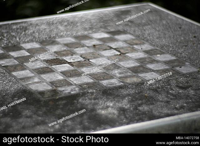 old weathered chess board in a public park
