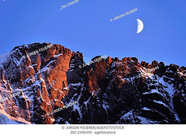 Alpenglow and moon, Hautes-Alpes, French Alps, France