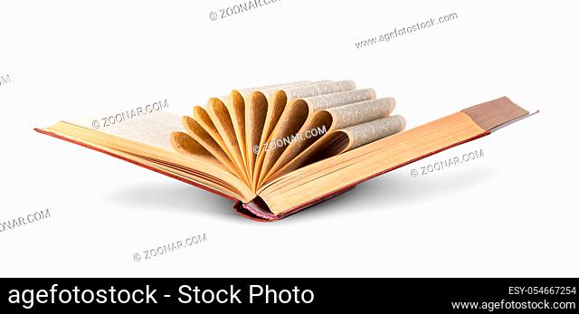 Ajar old book with curled pages isolated on white background