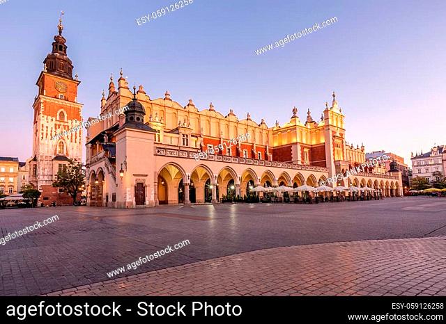 Market Square at sunrise in old city center at Krakow at morning time, main square, famous cathedral at sunrise in Krakow, Poland