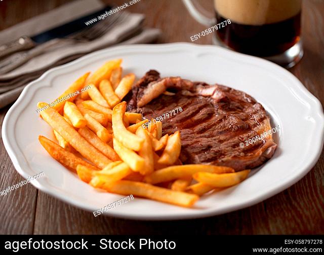 Beef steak with French fries. High quality photo