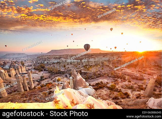 Colorful hot air balloons in Goreme national park, Cappadocia, Turkey. Famous touristic attraction