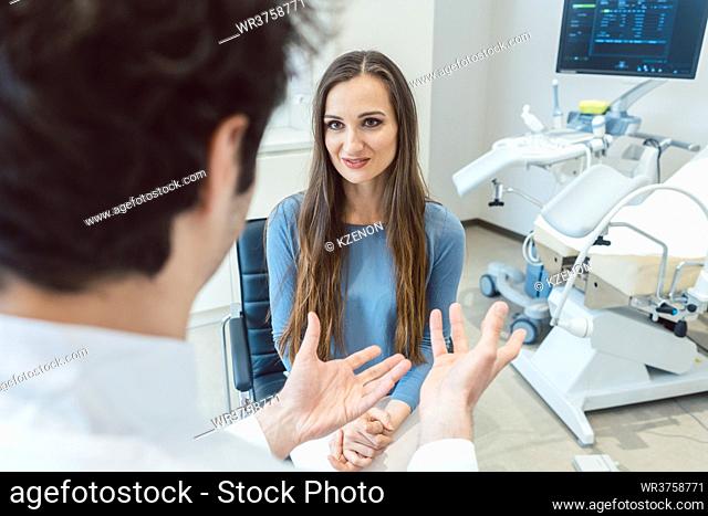 Woman visiting the gynecologist doctor in his office
