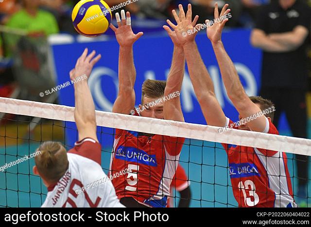 L-R Renars Pauls Jansons (LAT) and Adam Zajicek and Jan Galabov (CZE) in action during the 4th round of group C of European Volleyball League match Czech...