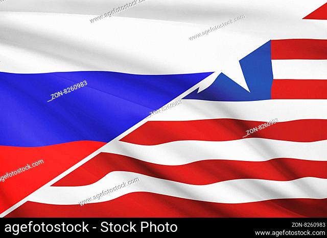 Flags of Russia and Republic of Liberia blowing in the wind. Part of a series