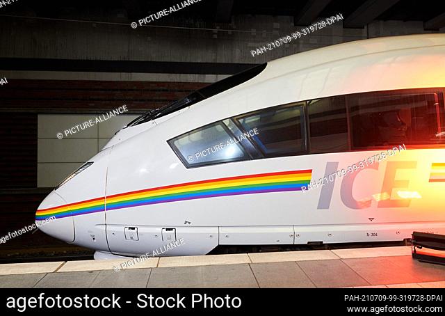 09 July 2021, Berlin: An ICE is painted with a strip of rainbow colours. ""Que(e)r durch Deutschland"" is the motto with which DB presents the rainbow ICE and...