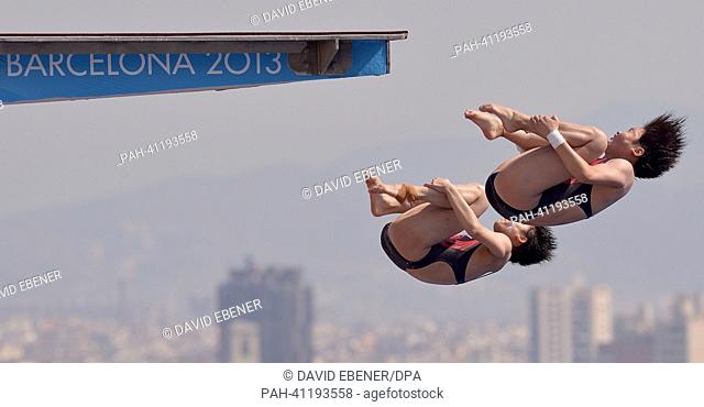 Huixia Liu and Ruolin Chen of China in action during the women's 10m Synchro Platform diving preliminaries of the 15th FINA Swimming World Championships at...