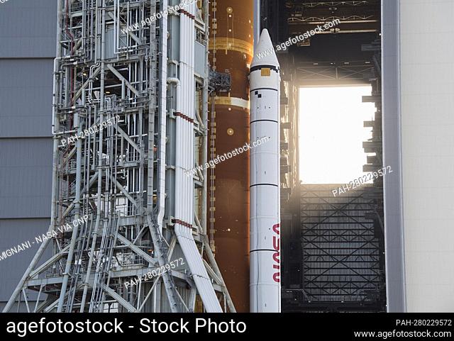 NASA’s Space Launch System (SLS) rocket with the Orion spacecraft aboard is seen atop a mobile launcher as it rolls out of High Bay 3 of the Vehicle Assembly...