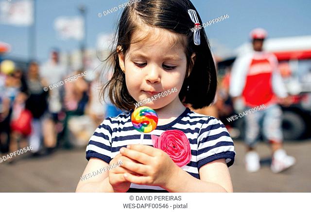 USA, New York, Coney Island, little girl with lollipop