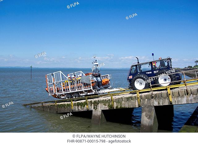 RNLI B-class Atlantic 85 rigid inflatable lifeboat, being launched from slipway, Silloth, Solway Bay, Cumbria, England, June
