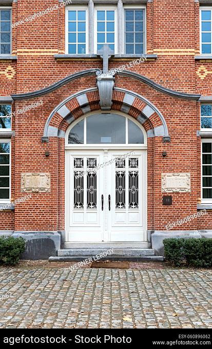 Leuven, Flemish Brabant Region, Belgium - 01 29 2022: Renovated facade of brick stone apartment block