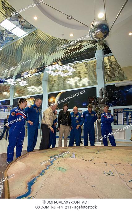 At the Korolev Museum in the Baikonur Cosmodrome in Kazakhstan, the Expedition 4142 prime and backup crews look at a model of the landscape of the Cosmodrome...