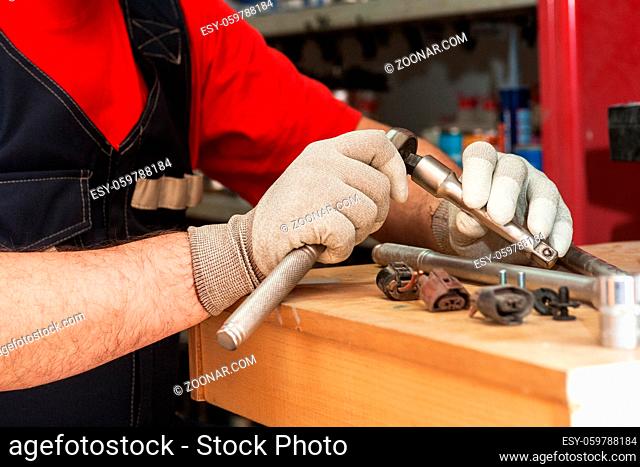 Professional mechanic working in repair service