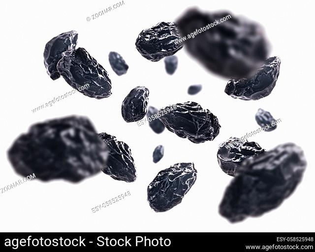 Dried prunes levitate on a white background