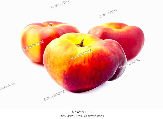 Saturn peaches on a white background