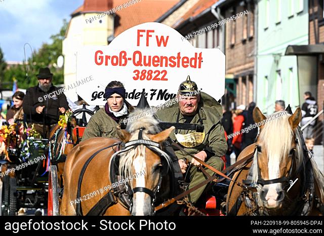 18 September 2022, Saxony-Anhalt, Schwanebeck: A historical fire department team from the neighboring town of Groß-Quenstedt during the parade through...