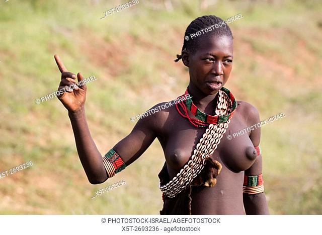 Portrait of a Young topless teen member of the Bena Tribe, Omo Valley, Ethiopia