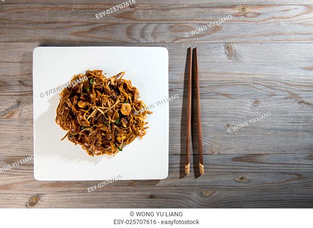 Fried Penang Char Kuey Teow which is a popular noodle dish in Malaysia, Indonesia, Brunei and Singapore.