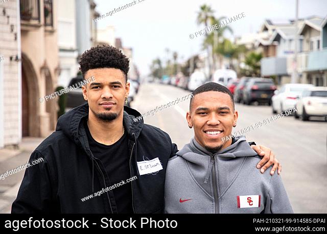 FILED - 09 February 2021, US, Newport Beach: Amon-Ra St. Brown (r) and his brother Equanimeous St. Brown stand on a street