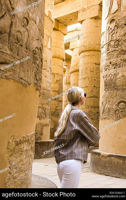 Young woman in the Great Hypostyle Hall in the Precinct of Amon-Re, Karnak Temple Complex, Luxor, Egypt, Northeast Africa
