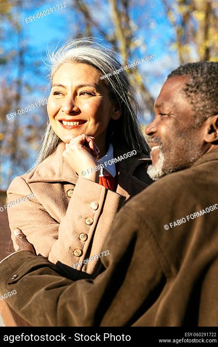 Smiling older woman flexing biceps, Stock Photo, Picture And