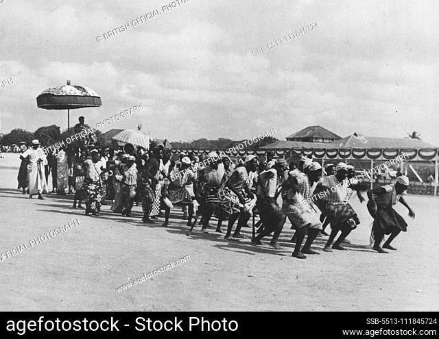 Gold Coast Durbar -- Preceded by native dancers, the headman of Ewe arrives in state for the Durbar held by the Ga State Council in honour of Nii Tackie Kone II...