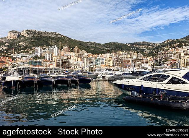 Monaco principality, city skyline and yachts in Port Hercules on Mediterranean Sea