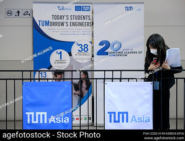 14 June 2022, Singapore, Singapur: A staff member from the Asia Campus of the Technical University of Munich (TUM) waits for the arrival of German President...