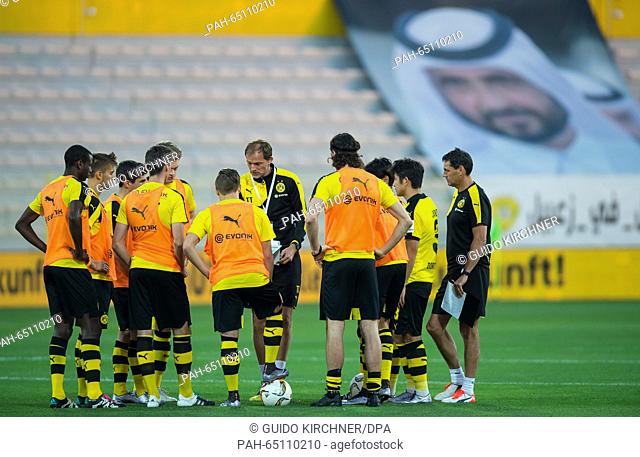Dortmund's coach Thomas Tuchel (m) advises his team at half time during the test match between Jeonbuk Hyundai Motors FC vs