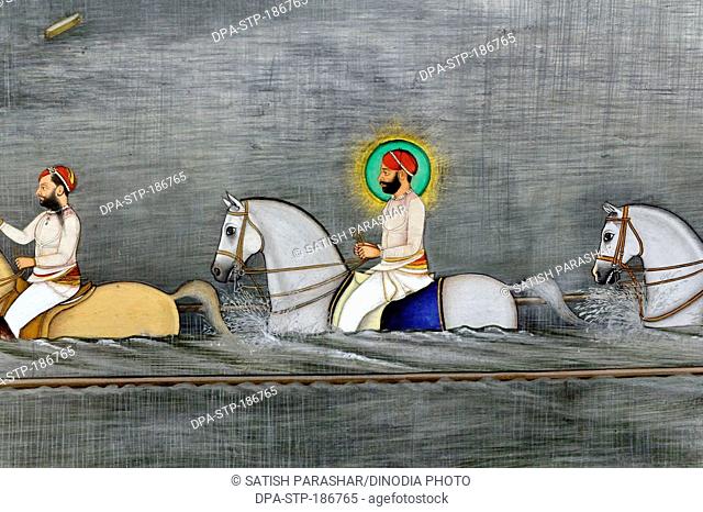 Miniature painting of maharana fateh singh ji on horse crossing river in udaipur at rajasthan India Asia