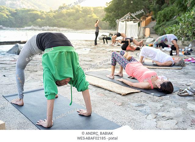 Mexico, Mismaloya, yoga class at ocean front
