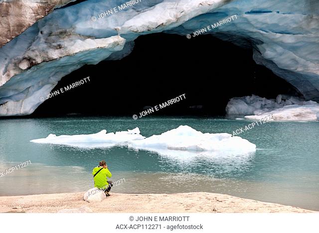 Photographing an ice cave at the toe of the Dartmouth Glacier, BC, Canada