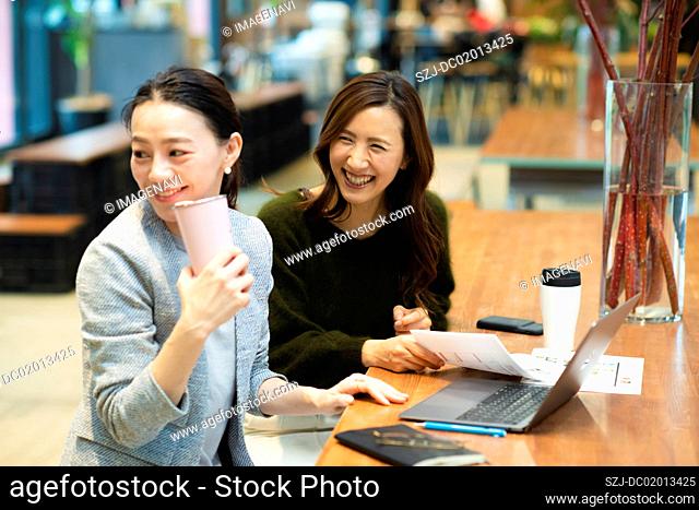 Two women in coworking office
