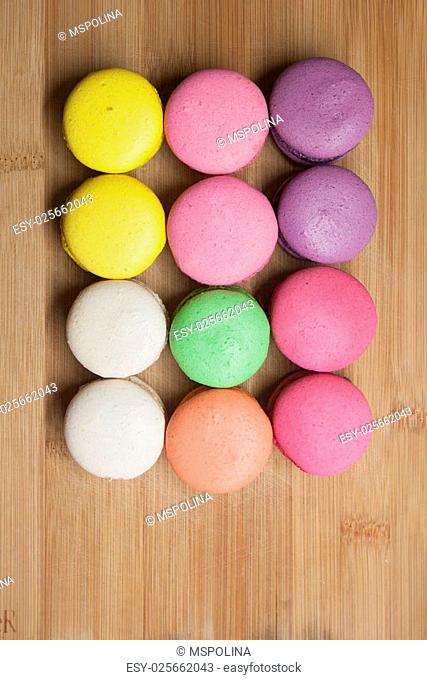 macaroons on the wooden coffee desk in vintage color tone