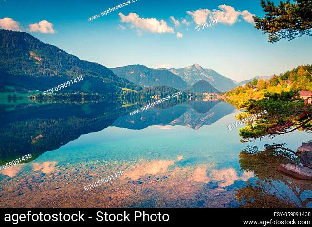 Sunny morning landscape on Grundlsee lake. Beautiful summer view of Gessl village, Liezen District of Styria, Austria, Alps. Europe