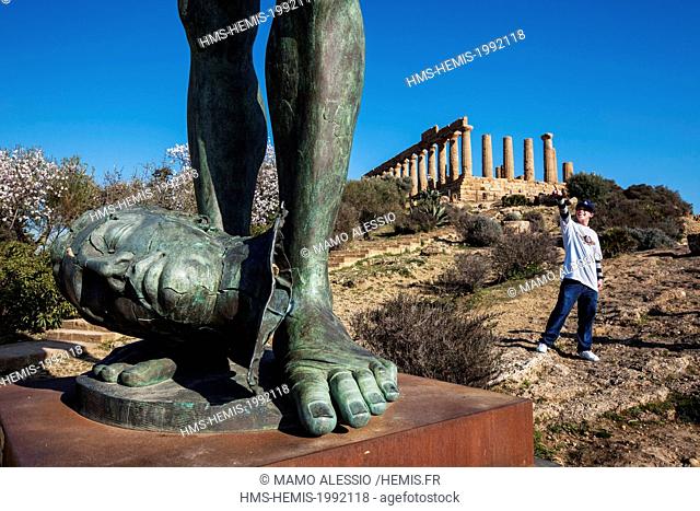 Italy, Sicily, Agrigento, listed as World Heritage by UNESCO, Valley of temples, Temple of Juno with a bronze sculpture of the polish sculptor Igor Mitoraj