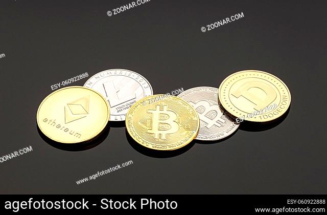 Cryptocurrency coins on dark background. Blockchain money