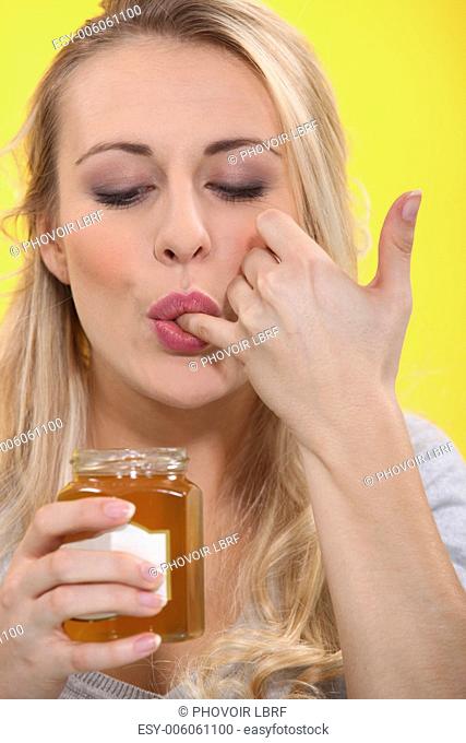 Woman tasting marmalade